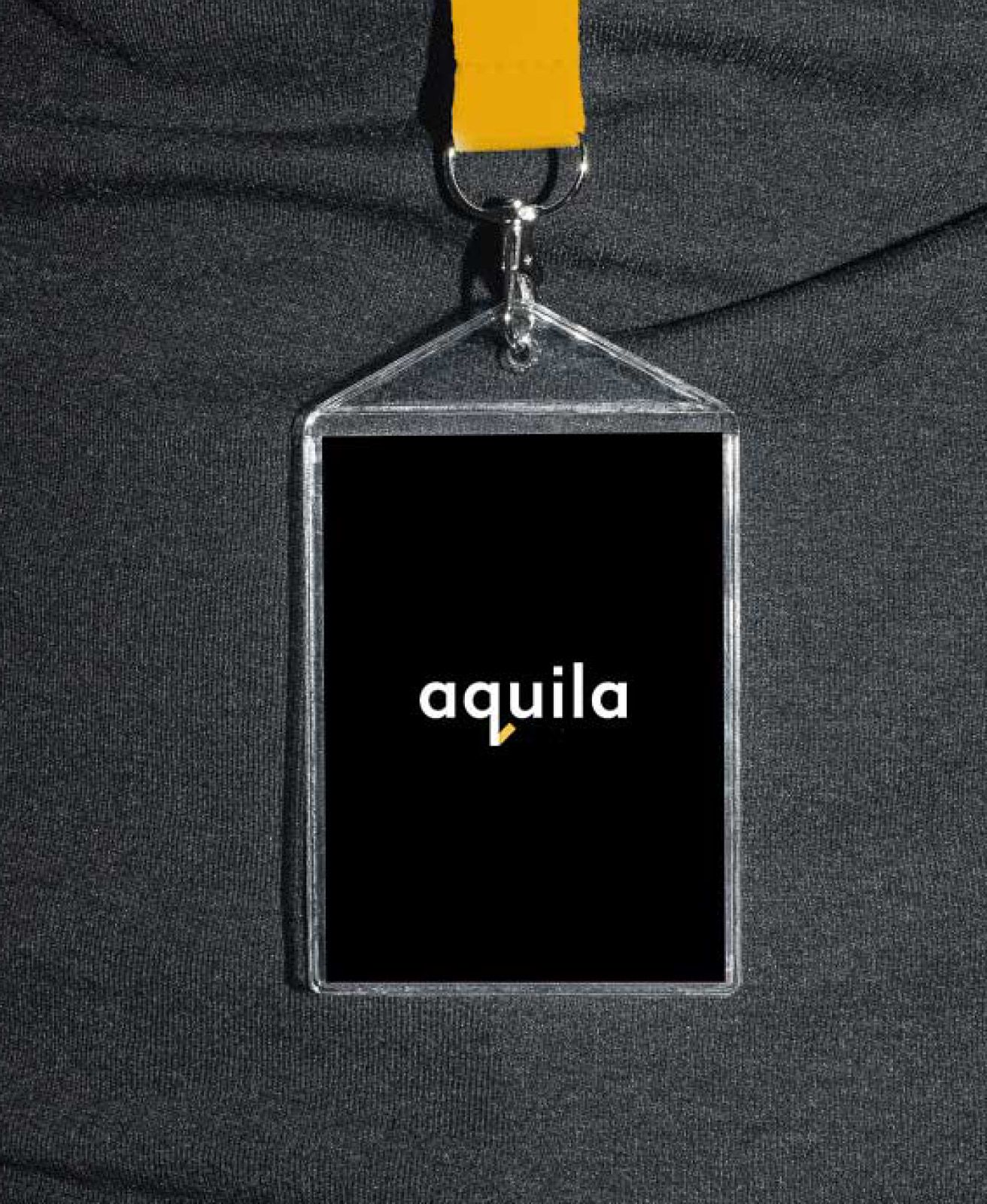 The Aquila brand identity on a lanyard pass