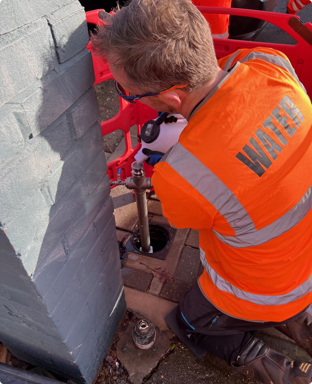 An engineer carrying out a trenchless pipe repair on site