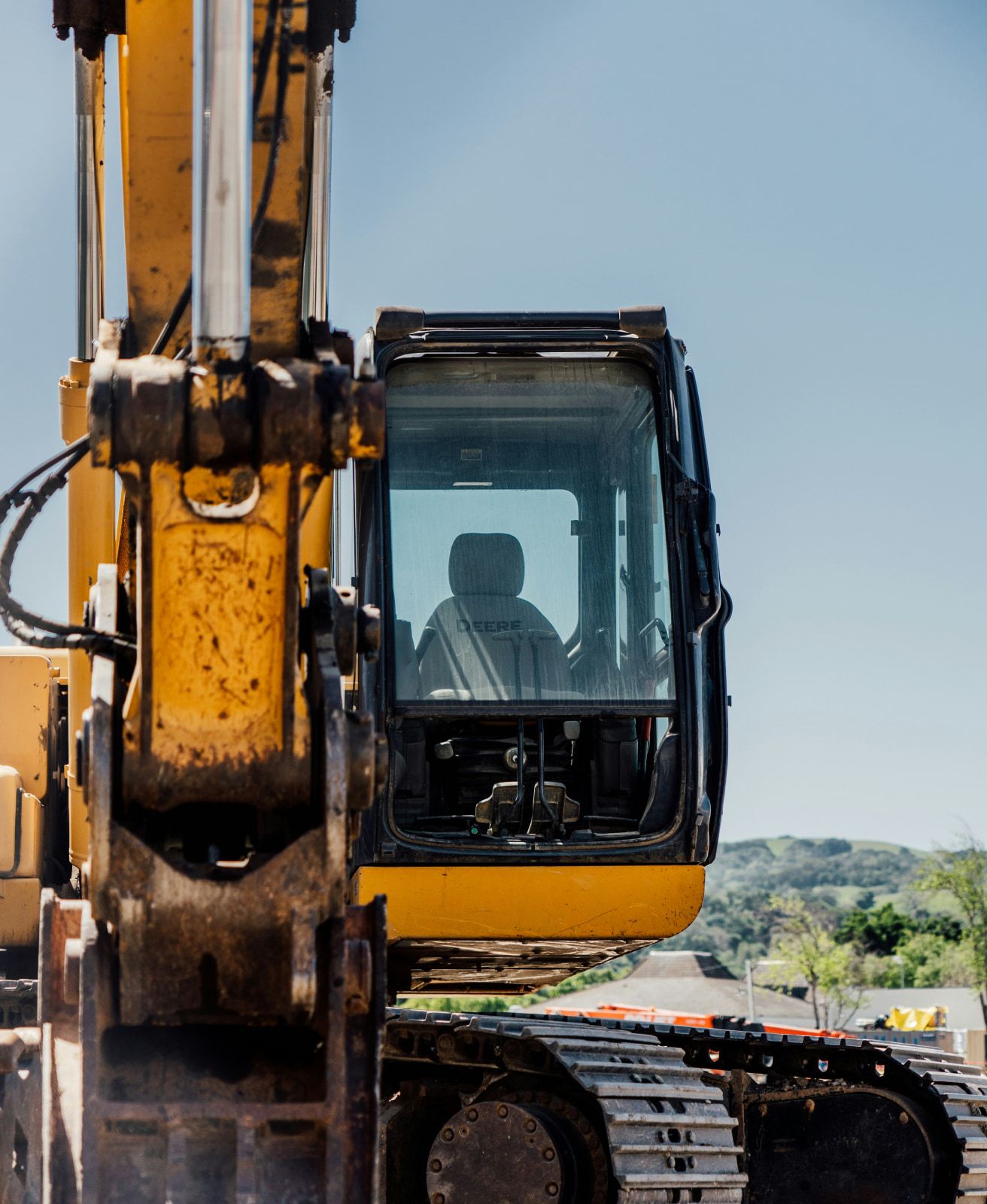 A tracked excavator working on a construction site