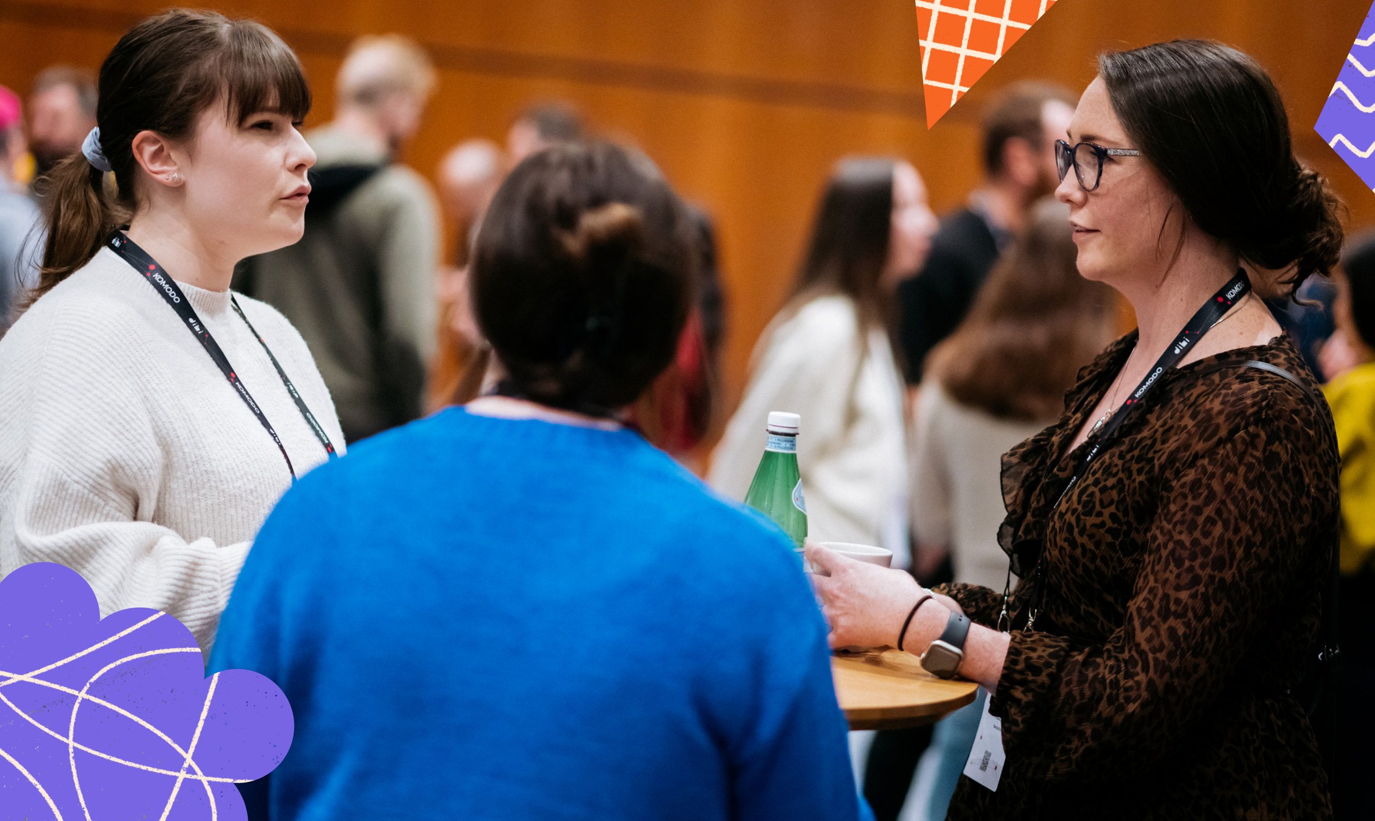 Attendees talking between sessions at DIBI