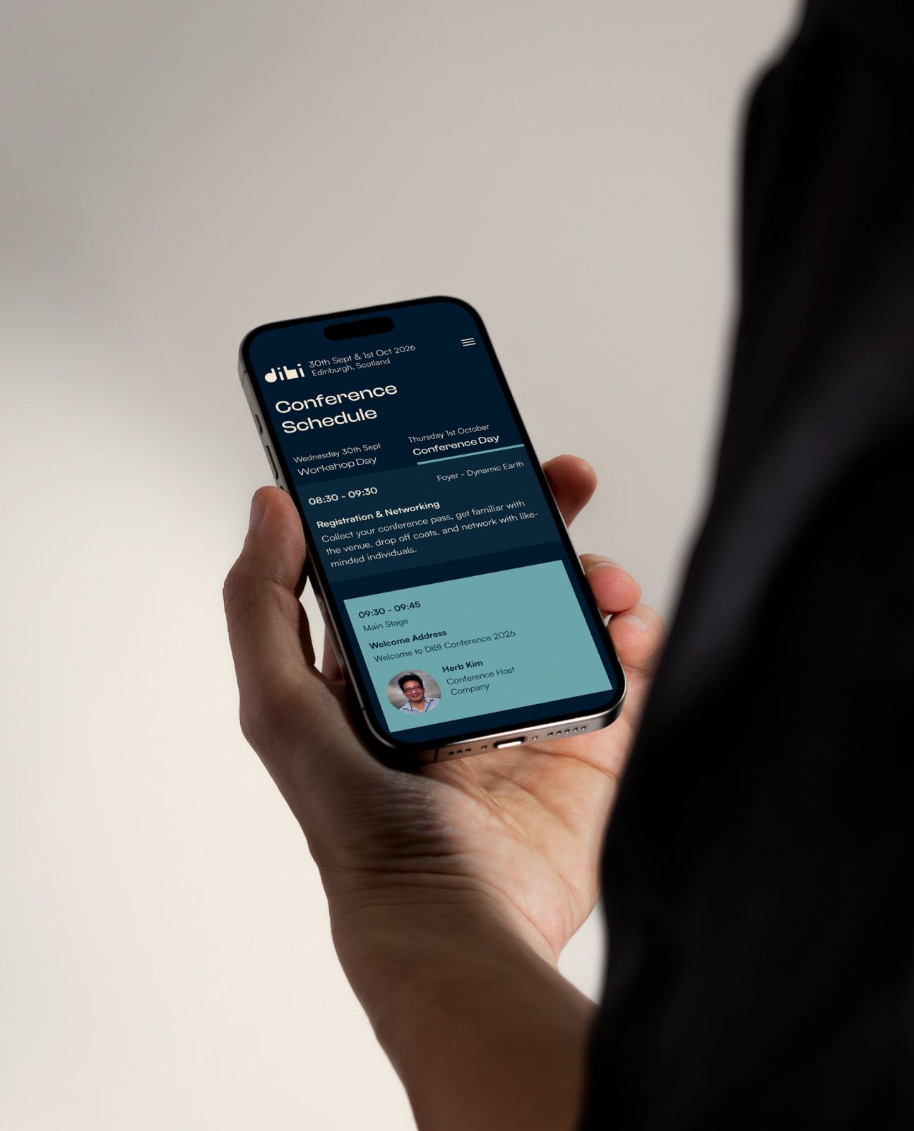 The DIBI conference schedule on a phone in an attendee's hand